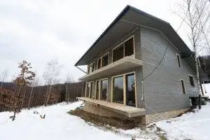 Alone wooden country house in snowy mountains. Soul weekends. Life without neighbors.