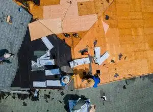 Roofer repair replace shingle that has been damaged and needing replacement